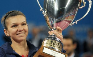 Romania's Simona Halep celebrates with the cup after winning the WTA tennis Tournament of Champions final match against Australia's Samantha Stosur in Sofia on November 3, 2013. AFP PHOTO / NIKOLAY DOYCHINOV (Photo credit should read NIKOLAY DOYCHINOV/AFP/Getty Images)